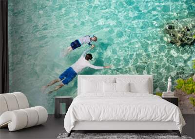 family snorkeling at caribbean Wall mural