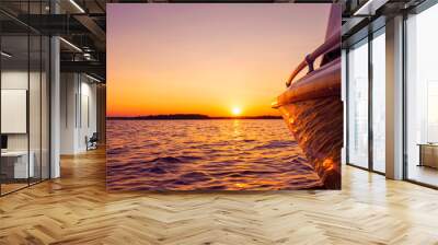 Side view Speeding fishing motor boat with drops of water. Blue ocean sea water wave reflections at the sunset. Motor boat in the blue ocean. Ocean yacht. Sunset at the sailboat deck Wall mural