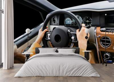 woman's hands on the steering wheel driving modern luxury car. concept woman driving. hands holding  Wall mural