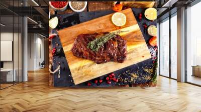 rib eye steak with margarine on a cutting Board Wall mural