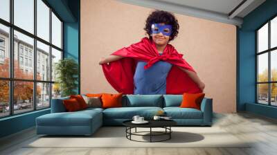 A portrait of kid boy in costume of superhero. Childhood and success concept Wall mural