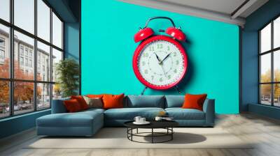 Alarm clock on the color background. Wall mural