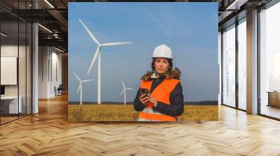 Young female specialist with smartphone Wall mural