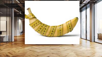 A measuring tape wrapped around a banana. The concept of penis enlargement, healthy eating, dieting and weight loss Wall mural