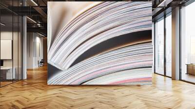 Colorful pages of an open magazine, close up. Selective focus. Wall mural