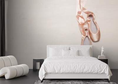 Ballet pointe shoes isolated on wooden background Wall mural