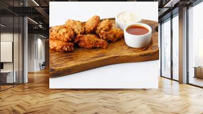 fried chicken wings with two sauces isolated on white background Wall mural