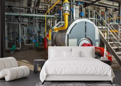 Interior of an industrial boiler room with boilers, many pipes, valves and sensors Wall mural