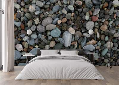 Pebble beach stones background, natural rounded gravel on the seashore nature background texture pattern Wall mural