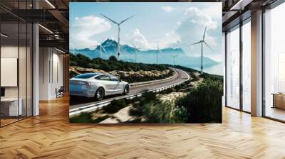 Electric car drive on the wind turbines background. Car drives along a mountain road. Electric car driving along windmills farm. Alternative energy for cars. Car and wind turbines farm. 3d render Wall mural