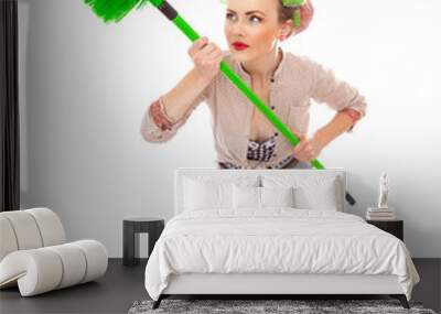 Funny cheerful housewife / girl with broom, isolated on white Wall mural