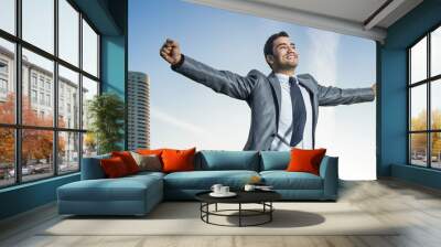 Successful businessman with his arms wide open Wall mural