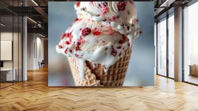 A colorful image of a cone of ice cream topped with fresh raspberries Wall mural