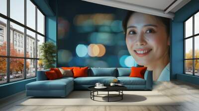 A woman with a bright smile standing in front of a cityscape at night Wall mural