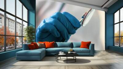 doctor's hand in a medical glove holds a phonendoscope. medical concept Wall mural