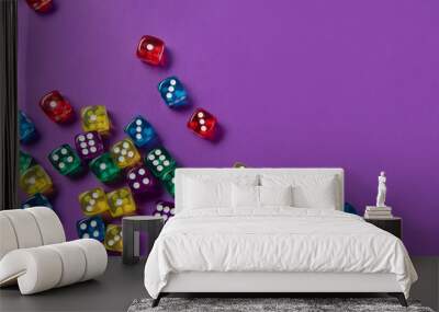 Bright and colorful dice set on violet background Wall mural