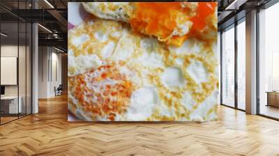 fried delicious eggs. Breakfast on a plate. Wall mural