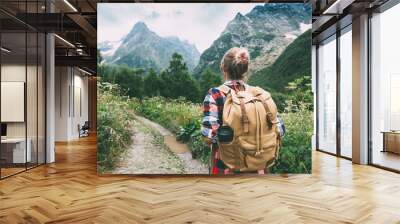 hiker walking to mountains Wall mural