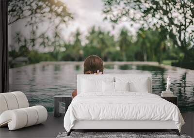 Infinity pool with a view on palm trees, Ubud, Bali Wall mural