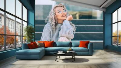 Plus size model with blond curly hair in knitted sweater outdoor Wall mural