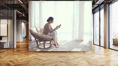 woman relaxing in chair Wall mural