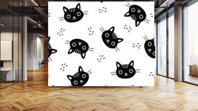 Seamless vector pattern. Cute faces of cats in black and white colors. Funny cats for printing on children's products . Vector illustration Wall mural