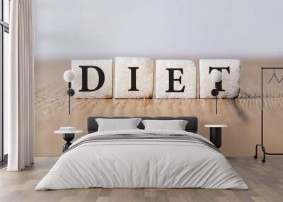 Sugar block form the word DIET on wooden background. Promoting a more healthy diet. Medical and health care concept. Wall mural