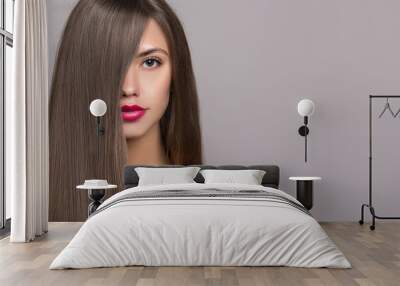 woman with long straight brown hair. portrait of a girl with bright makeup Wall mural