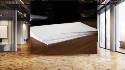 Workspace with blank paper on wooden table, selective focus, copy space, top view. Business, school concept Wall mural