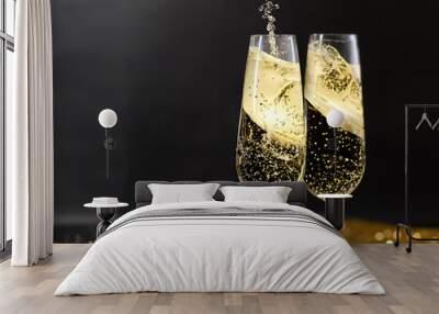 flutes with champagne or fizzy white wine on black background with blurred sparkles in the back Wall mural