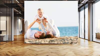 happy family having fun on beach Wall mural