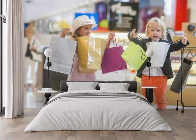 Kids shopping. cute little girl and boy on shopping. portrait of Wall mural