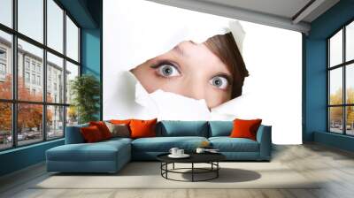 young girl peeping through hole in paper Wall mural