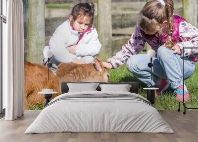 young kids taking care of animals on a farm Wall mural