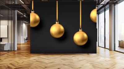 Golden  hanging Christmas balls isolated on black  background. Wall mural