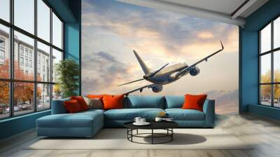 Airplane flying above  sunset Wall mural