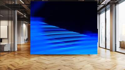 Illustration of abstract gradual rhythmic light trails with striped glowing blue texture Wall mural