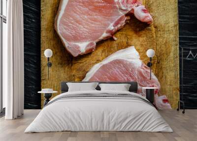 Pork steak raw on a kitchen cutting board Wall mural