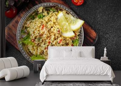 Tabbouleh bulgur couscous vegetables dish fresh vegetarian and vegan food gourmet food background on the table rustic food top view  Wall mural