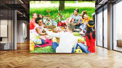 Group of friends enjoying a picnic while eating and drinking red wine Wall mural