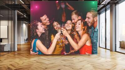 Happy friends celebrating new year eve holidays in disco club - Young people doing private party with deejay and drinking champagne - Youth culture entertainment lifestyle concept Wall mural