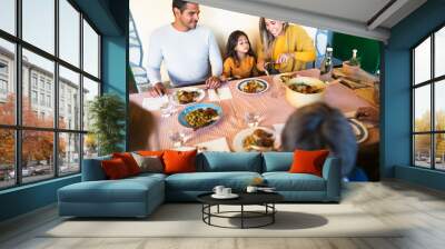 Happy Latin family having fun lunching together at home Wall mural