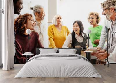 Happy multiracial people with different ages and ethnicities having a break during work time Wall mural