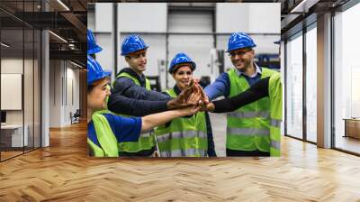 Team of multiracial engineers stacking hands together inside robotic factory - Tech industry concept Wall mural