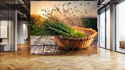 chives in a basket, vegetables on a wooden table, countryside in background Wall mural