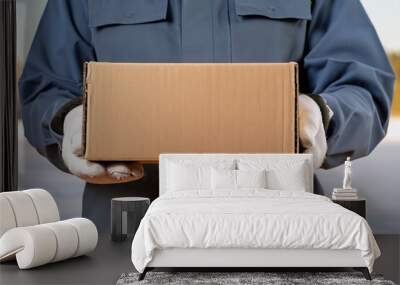 delivery man carrying a parcel Wall mural