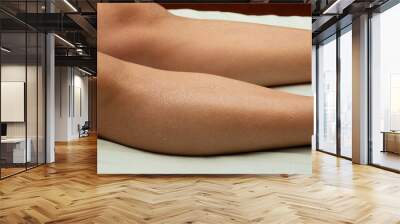 Woman's legs with dry skin that is ashamed. Wall mural