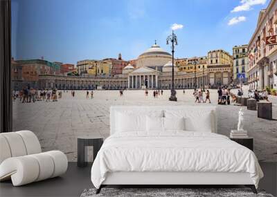 Naples, Italy. View on a sunny day of Piazza Plebiscito with some tourists walking across the square. In the background the Royal Pontifical Basilica of San Francesco da Paola. 2022-08-20. Wall mural