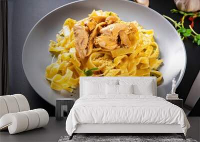 pasta with chicken and curry on  the table, delicious italian pasta dish Wall mural