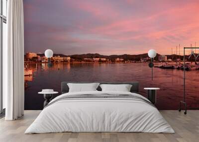 romantic pink sunset over the sea waters of the port of san antonio in ibiza Wall mural